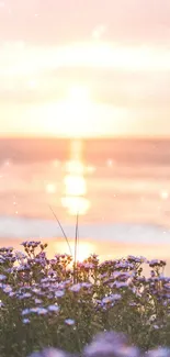 Serene sunset over ocean with flowers and beach in the foreground.