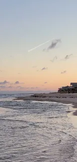 Peaceful beach sunset with gentle waves and golden sky.