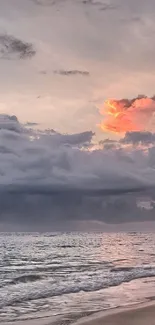 Serene beach sunset with vibrant clouds and peaceful ocean view.