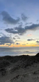 Beautiful beach sunset with scenic ocean view and sand dunes.