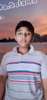 Boy stands on a beach at sunset, illustrating tranquility.