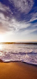 A serene beach with a sunset sky and calming ocean waves.