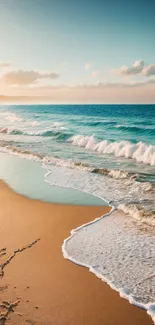 Serene beach at sunset with ocean waves and a colorful sky.