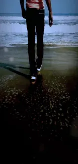 Person walking on a tranquil beach during sunset.