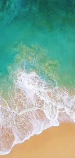 Aerial view of a turquoise beach with gentle waves.