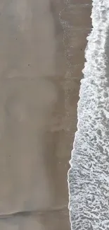 Serene beach with gentle waves along the shoreline.