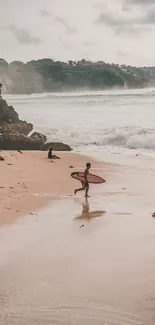 Relaxing view of surfers on a sandy beach with waves.