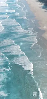 Serene beach with ocean waves crashing onto sandy shore under sunlight.