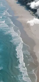 Aerial view of serene beach with turquoise waves and sandy shores.