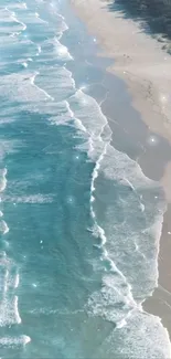 A calming beach scene with gentle blue waves and sandy shore.