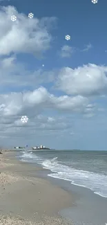 Tranquil beach with snowflakes and blue sky wallpaper.