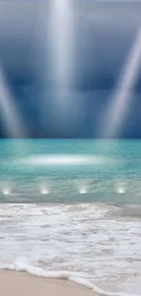 Serene beach with rays of light shining down on the calm ocean.