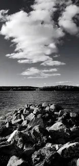 Black and white rocky shoreline with dramatic clouded sky.