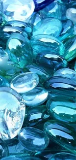 Close-up of smooth, glossy blue glass stones with a tranquil appearance.