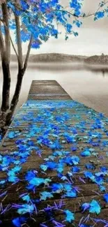 A serene blue lake with leaves on a misty pier.