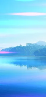 Serene blue lake with forest and mountains reflection.