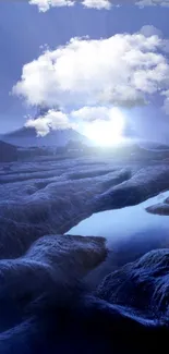 Tranquil blue landscape with clouds and a river.