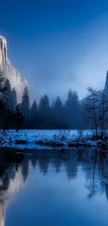 Peaceful blue mountain landscape with misty river reflecting scenery.