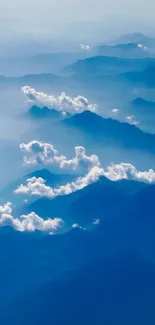 Serene mountain range with clouds in blue hues for mobile wallpaper.