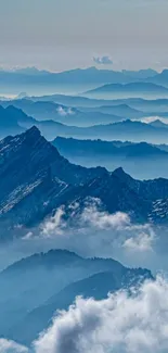 Serene blue mountains with misty clouds in the background.