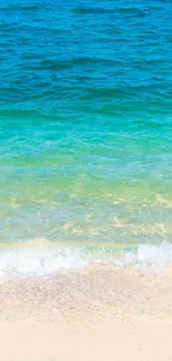 Tranquil beach with vivid blue ocean waves gently hitting the sandy shore.