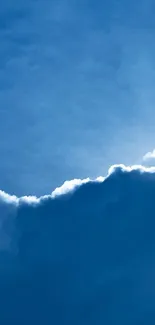 Blue sky with billowing clouds creating a serene scene.