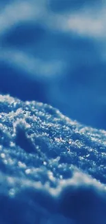 Close-up of a blue textured surface with abstract waves.