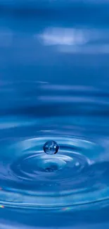 Serene blue water ripple with a droplet in motion, creating calming effect.