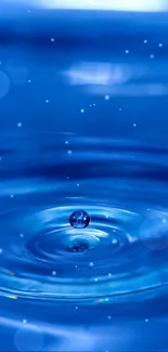 Close-up of a blue water ripple with a droplet in motion, creating a serene effect.