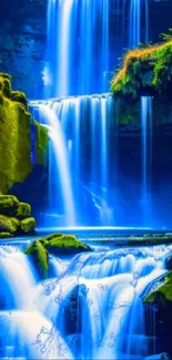 Serene blue waterfall cascading over rocks with lush greenery.