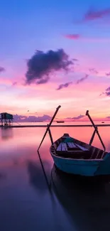 Peaceful boat on a reflective bay at sunset with vibrant purple hues.