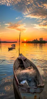 Boat on a calm lake at sunset with vibrant orange and blue hues.