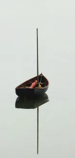 A lone boat on calm, reflective waters creating a serene and minimalistic scene.