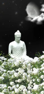 Buddha statue in a moonlit garden surrounded by white flowers.