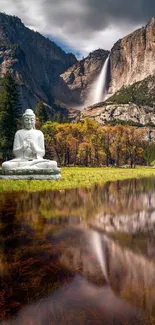 Buddha statue with waterfall and mountain view in peaceful landscape wallpaper.