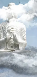 Serene Buddha statue surrounded by clouds in a tranquil sky.