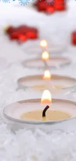 Snowy candlelit path with red accents.