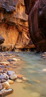 A serene canyon river with flowing water and rugged rock formations.