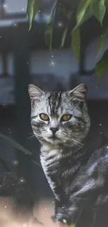 Serene cat surrounded by green leaves in a soothing natural setting.