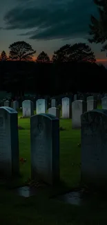 Serene cemetery with gravestones at dusk under a moody twilight sky.