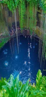 A breathtaking view of a cenote with lush greenery and vibrant blue water.