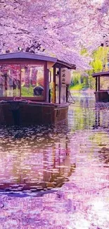 Serene canal with cherry blossoms and boats reflecting on water.