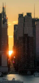 City skyline at sunset with golden hues and calm water.