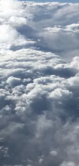 Mobile wallpaper featuring serene cloudscape with fluffy clouds and blue sky.