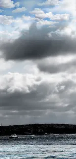 A peaceful ocean scene with dramatic clouds.