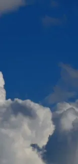 Serene clouds against a blue sky wallpaper.