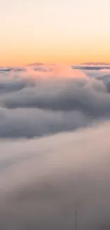 Clouds during sunset with a serene, light peach sky.