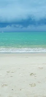 Serene beach with turquoise sea and cloudy sky.