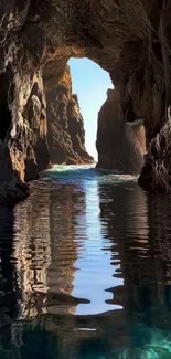 Serene view of a coastal cave with water reflections.