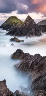 Serene coastal landscape with rocky formations and sunset.